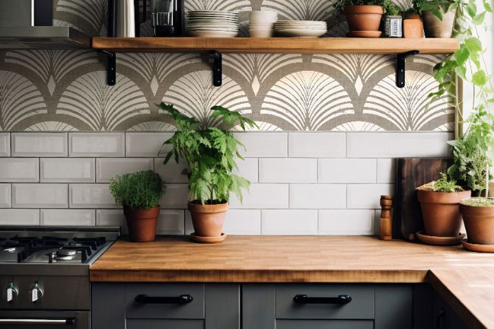 taupe fan wallpaper above white tile in kitchen with wood shelves plants and dark cabinets