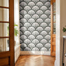 evercroft dark green fan wallpaper in bright entryway with warm wood doors and herringbone floors