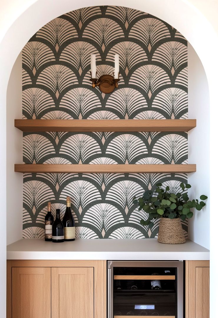 evercroft dark green geometric wallpaper in arched home bar niche with wood shelves and wine bottles