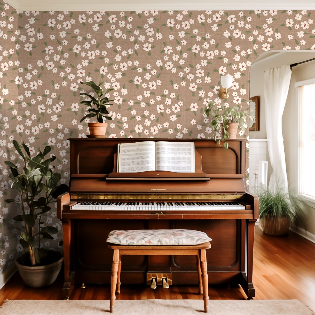 Warm neutral floral wallpaper with ivory blossoms and soft green leaves in a classic living room setting