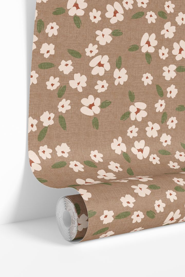Field & Stem floral wallpaper roll showing ivory flowers and muted green leaves on a taupe background