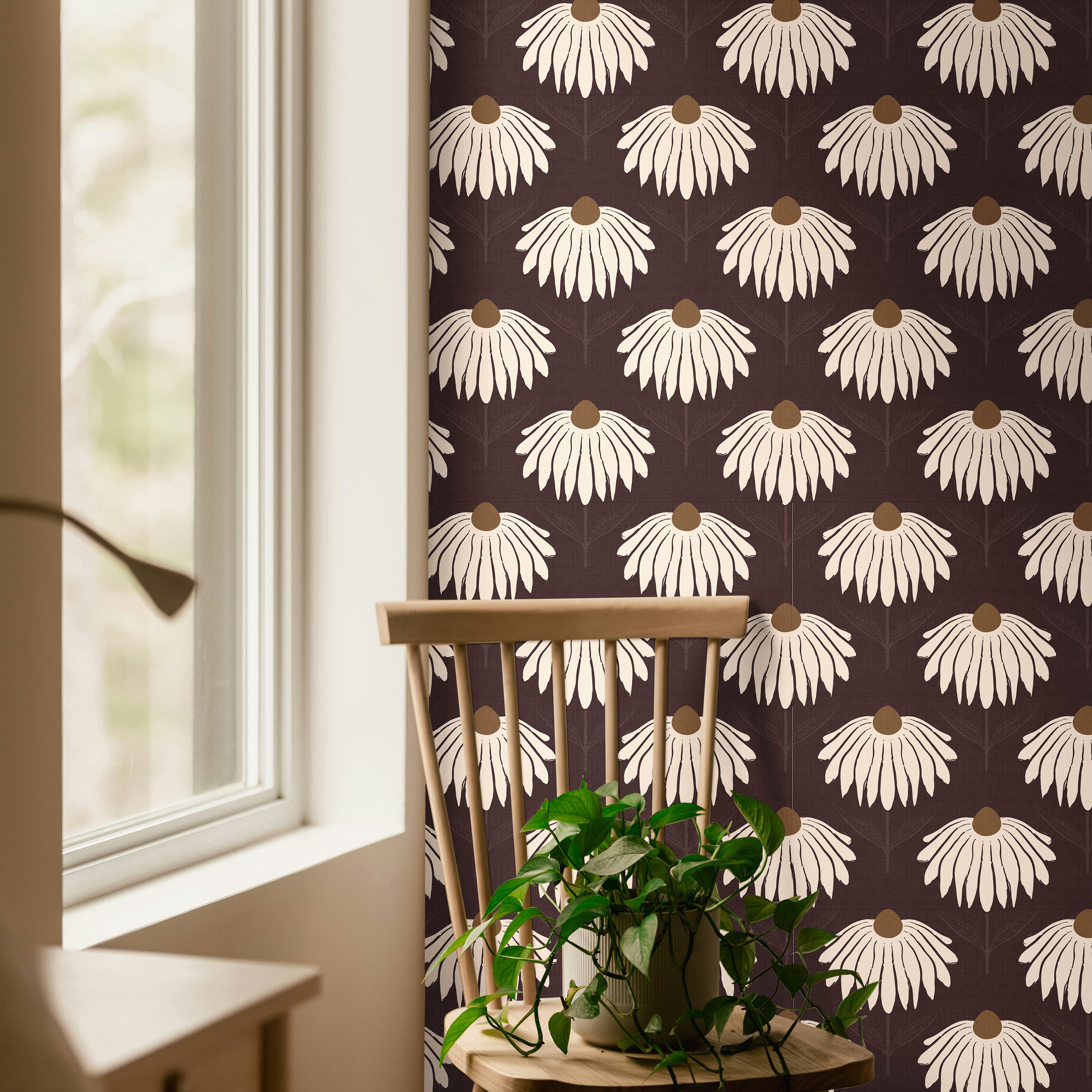 garnet crown 3543 cream coneflower wallpaper in reading nook with wood chair green plant and window