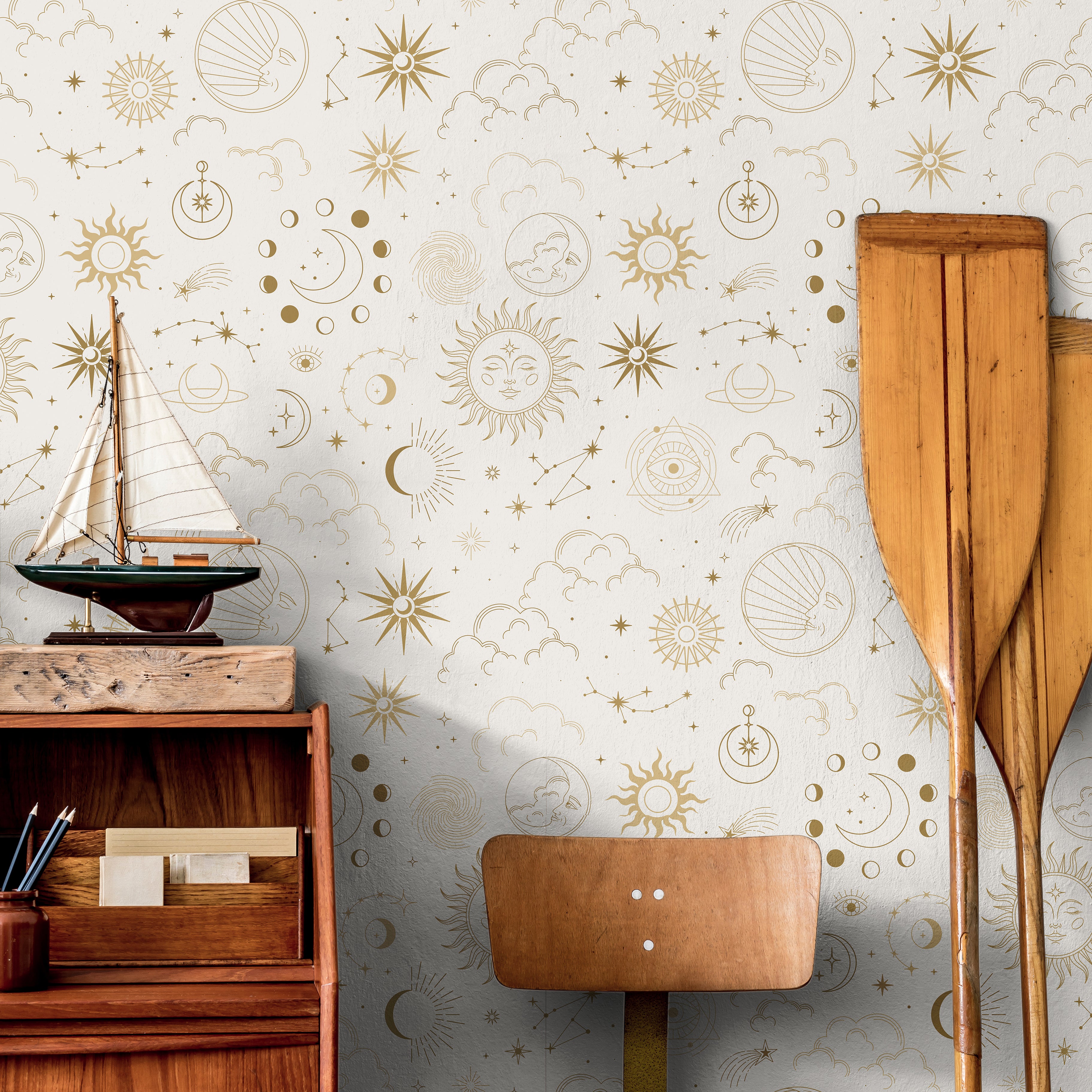 Sun and moon celestial patterns on light cream background in nautical themed boys room