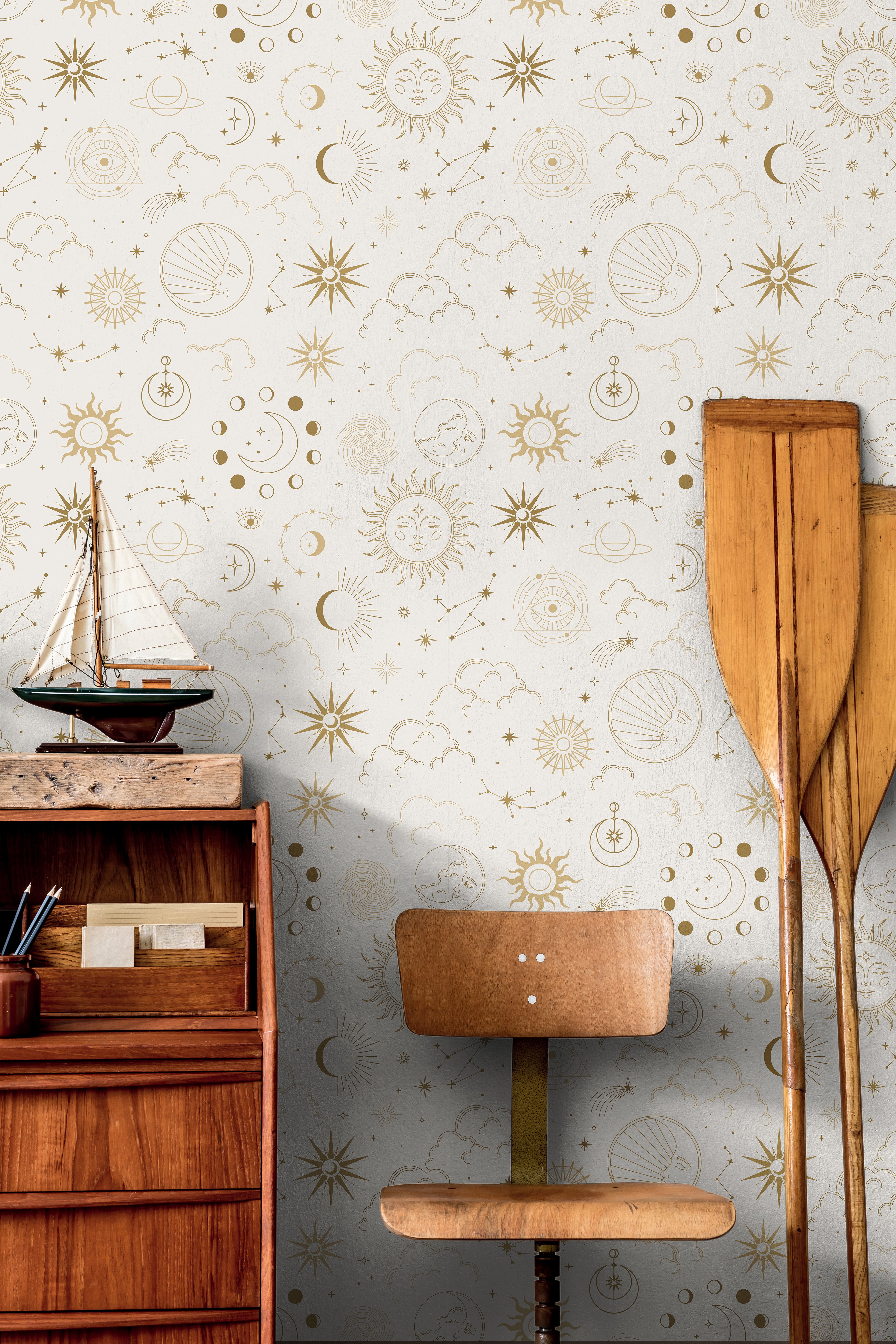 Sun and moon celestial patterns on light cream background in nautical themed boys room