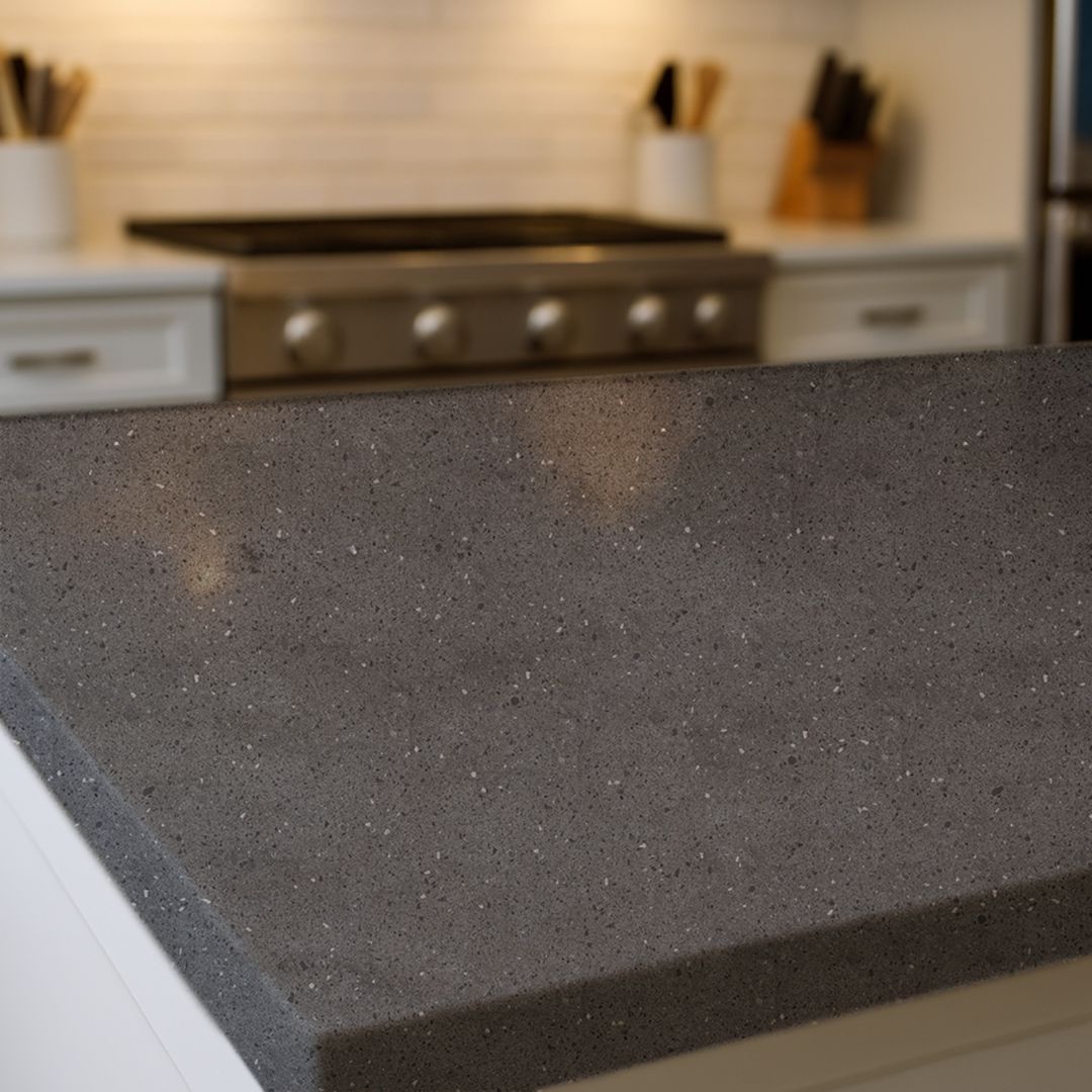 Close up of Graphite Terrazzo countertop film 82 showing dark gray stone flecking