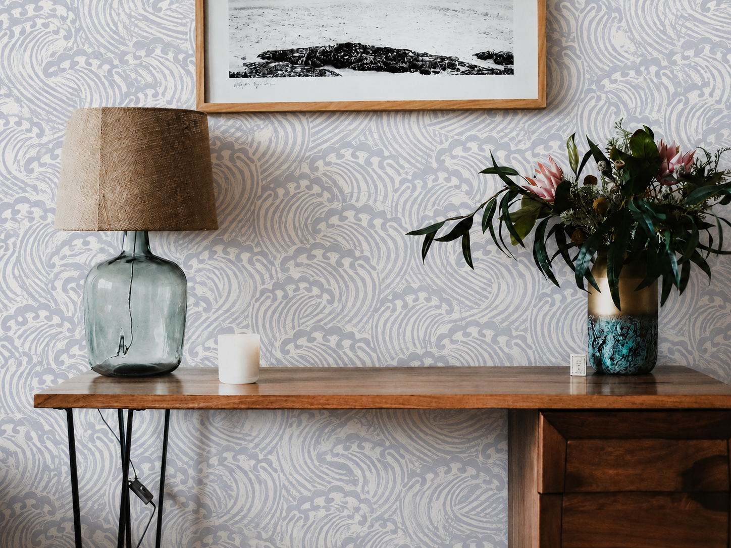 close view of harbor passage wallpaper with muted blue curling waves ivory linework and distressed texture