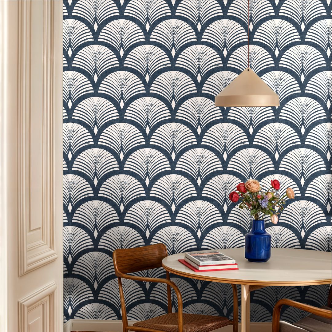 harborcroft navy wallpaper in bright dining nook with light wood table and fresh flowers – geometric arches – james & colors