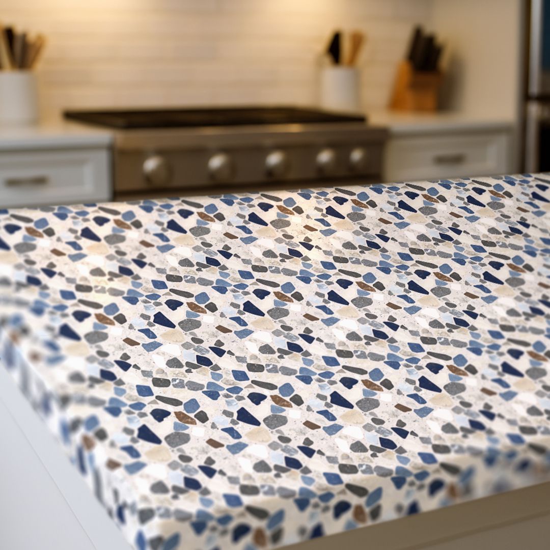 Harborstone Blend Countertop Film styled on modern kitchen island with navy and gray terrazzo design