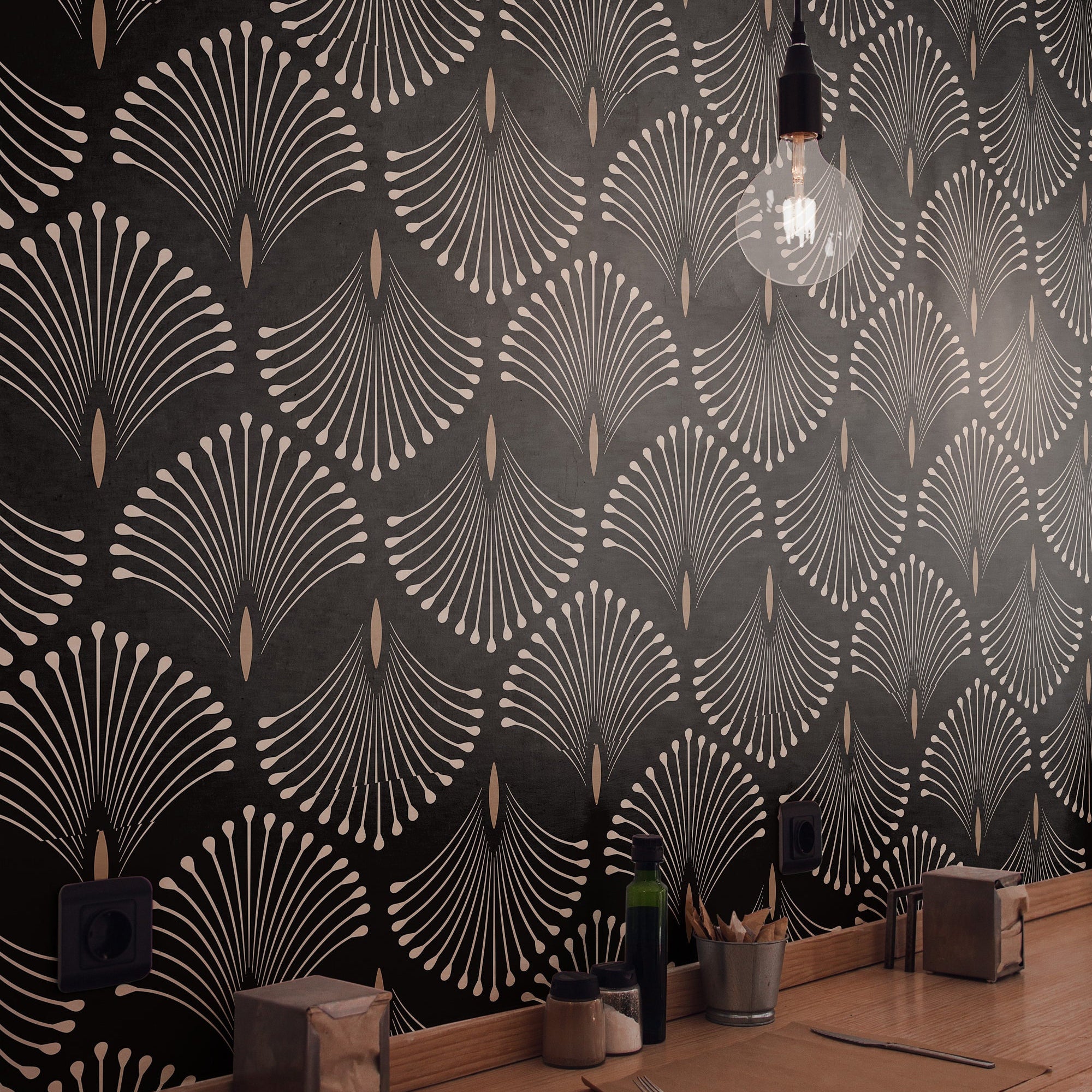 Wallpaper 1170a: Modern cafe counter with dramatic black wallpaper featuring a repeating fanburst pattern in soft beige lines, lit by a single hanging bulb.