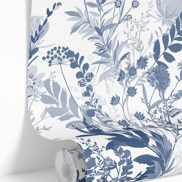 Indigo Meadow wallpaper roll featuring blue and white botanical floral design by James & Colors