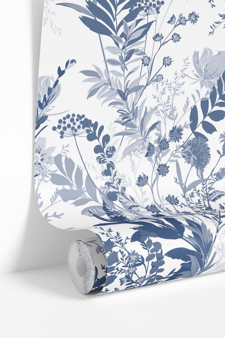 Indigo Meadow wallpaper roll featuring blue and white botanical floral design by James & Colors