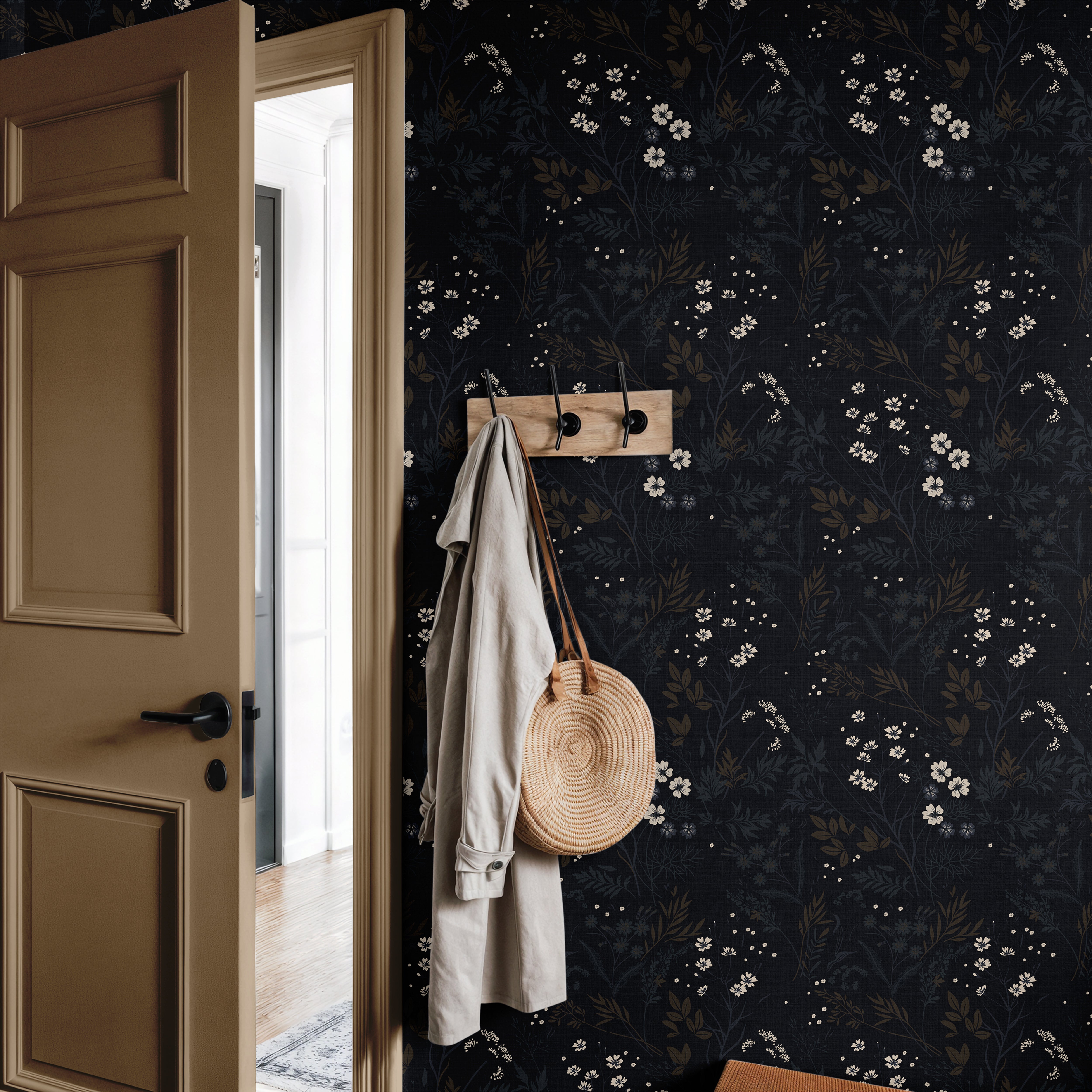 ink and elderflower 3552 black wildflower wallpaper in entryway with tan door coat hooks and woven bag