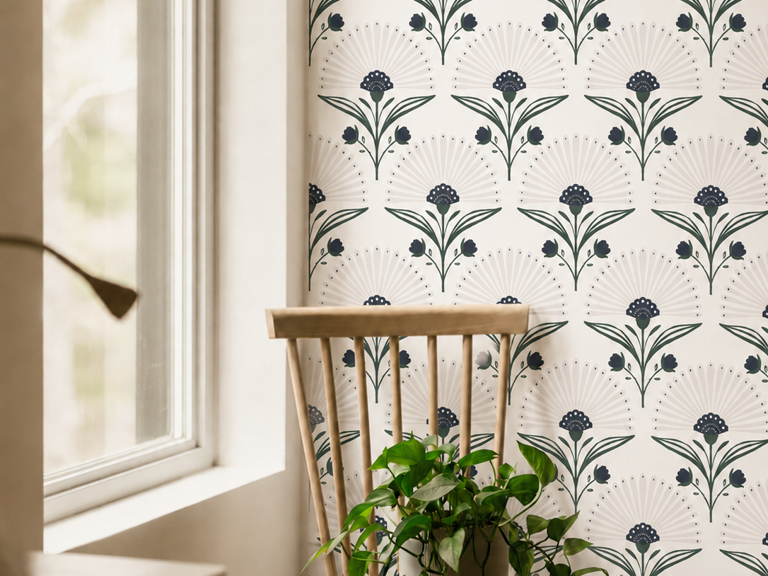 indigo and green art deco floral wallpaper beside window with wood chair and trailing plant