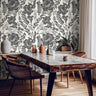Inkwell Botanica black floral wallpaper in a modern dining room with marble table
