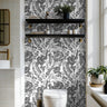 bold, black-and-white floral wallpaper inspired by hand-drawn botanical sketches
