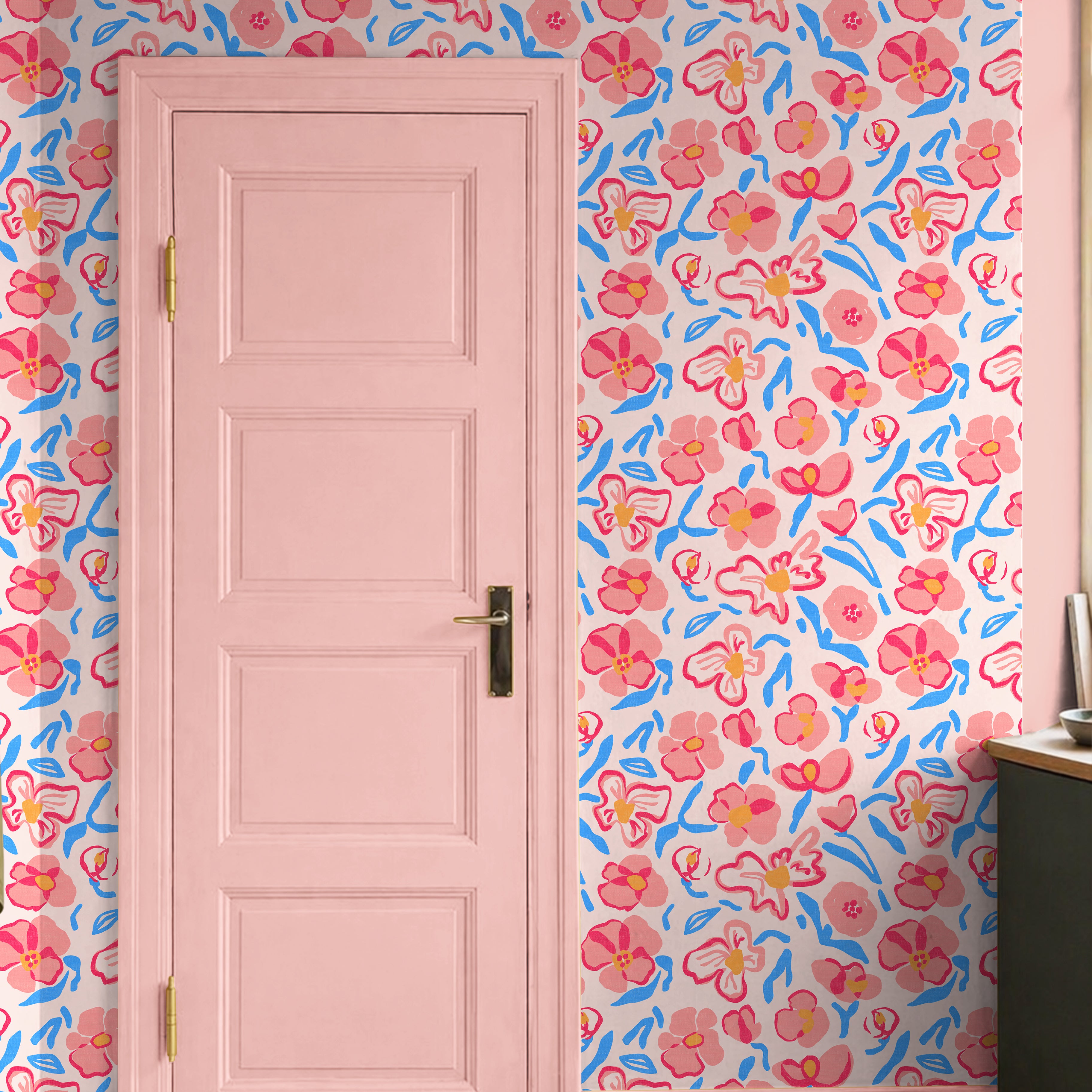 colorful floral wallpaper with pink flowers and blue accents in playful interior