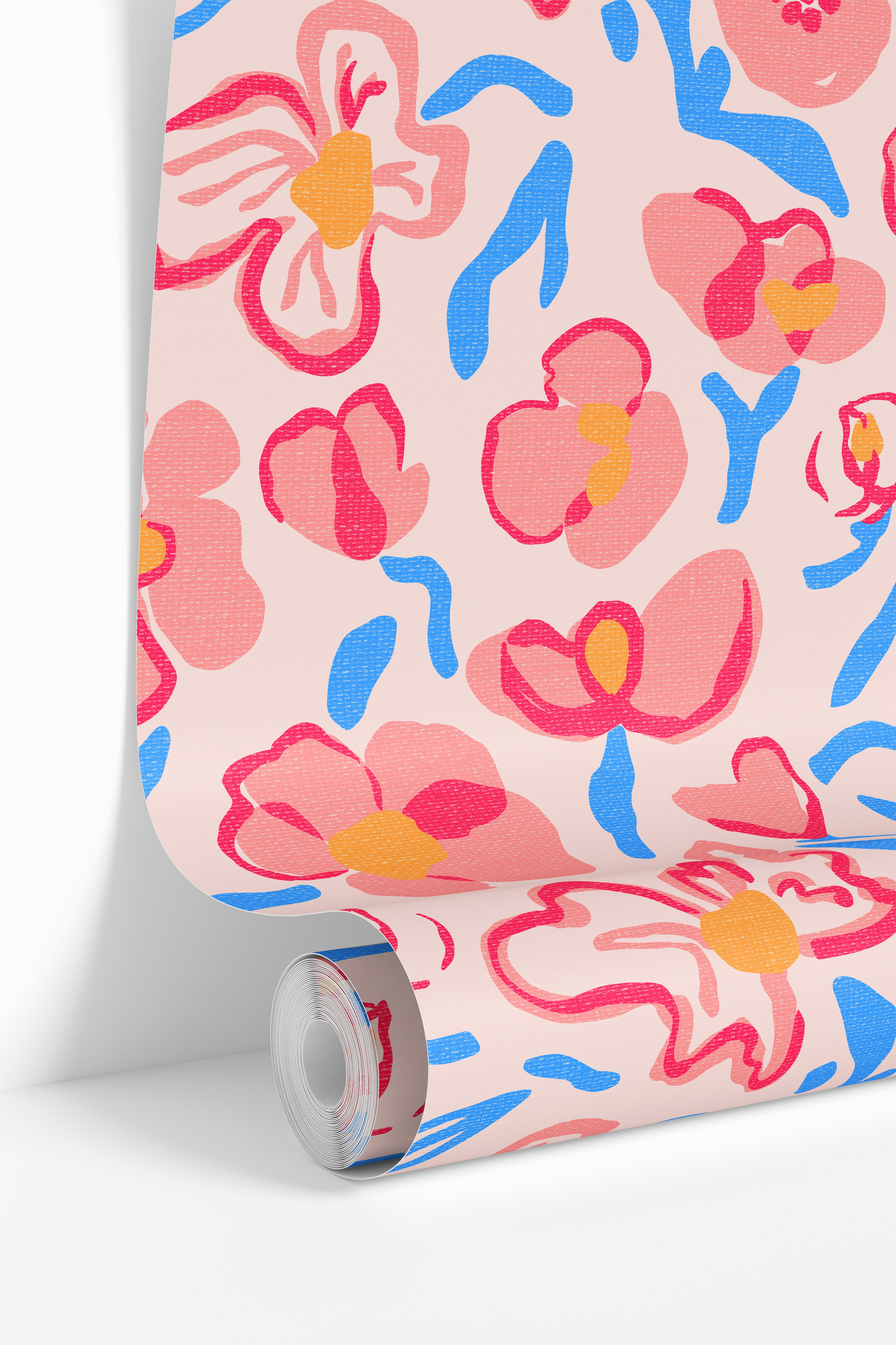 wallpaper roll showing colorful floral pattern with pink flowers and blue accents