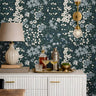 close up of blue green floral wallpaper with calico inspired botanical pattern
