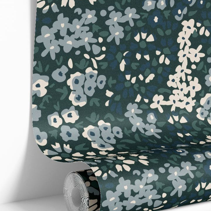 rolled floral wallpaper showing blue green calico botanical design