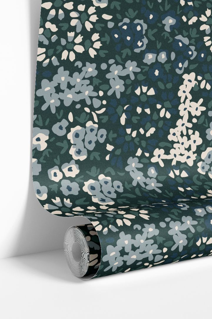 rolled floral wallpaper showing blue green calico botanical design