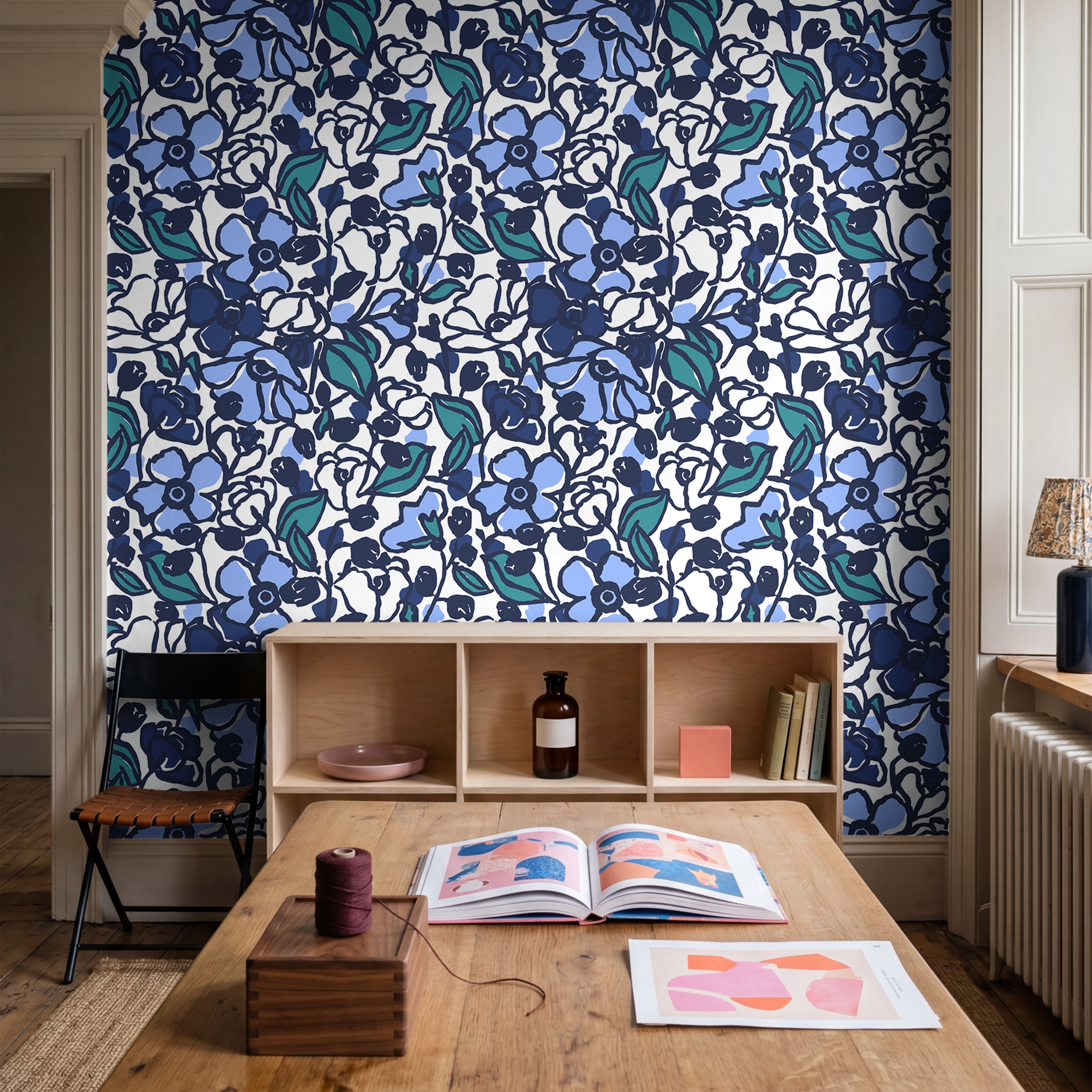  artistic dark floral wallpaper with navy tones in modern dining room
