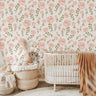 Close-up of Little Bloom Field wallpaper showing blush floral details and airy sage stems on a warm neutral background