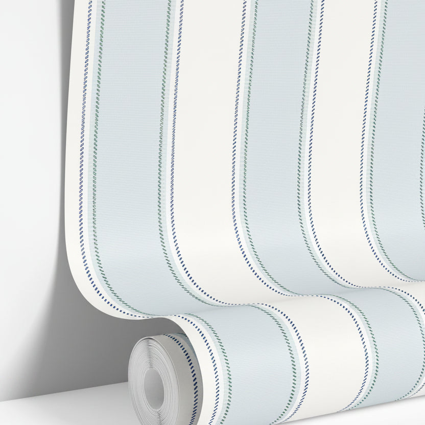 wallpaper roll showing blue and green stripe pattern with subtle pinstripe texture