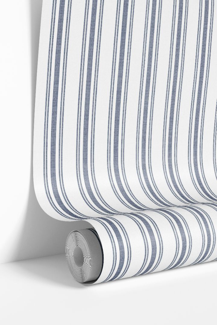 Close-up of Mariner’s Thread Wallpaper 2267 roll showing deep blue stripes and woven texture on a white background.