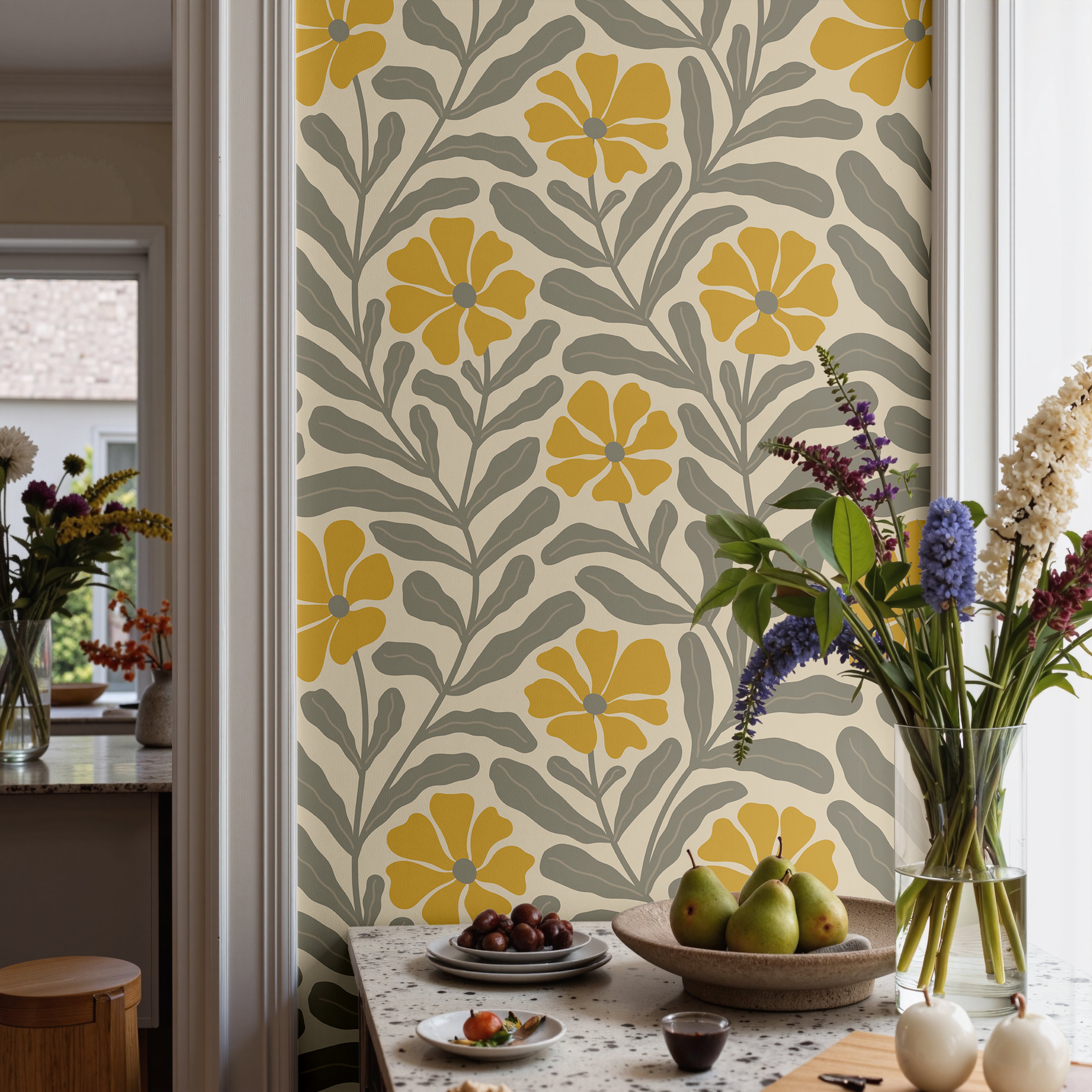 Retro floral wallpaper with golden blooms and flowing taupe botanical stems styled in a warm modern dining room.