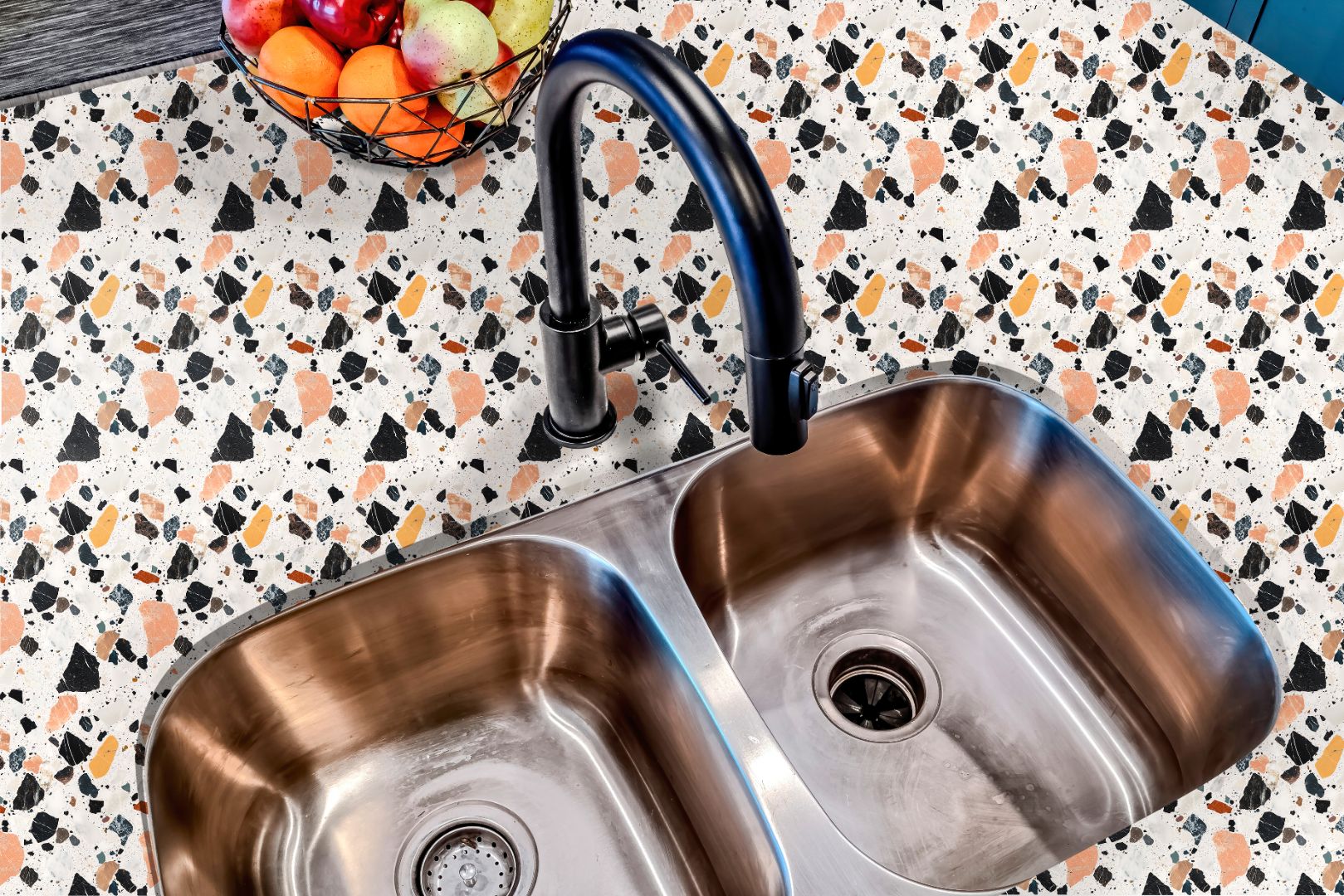 Kitchen sink area finished with Marlo Terra Stone Countertop Film, showing a refined terrazzo pattern for a warm, contemporary look