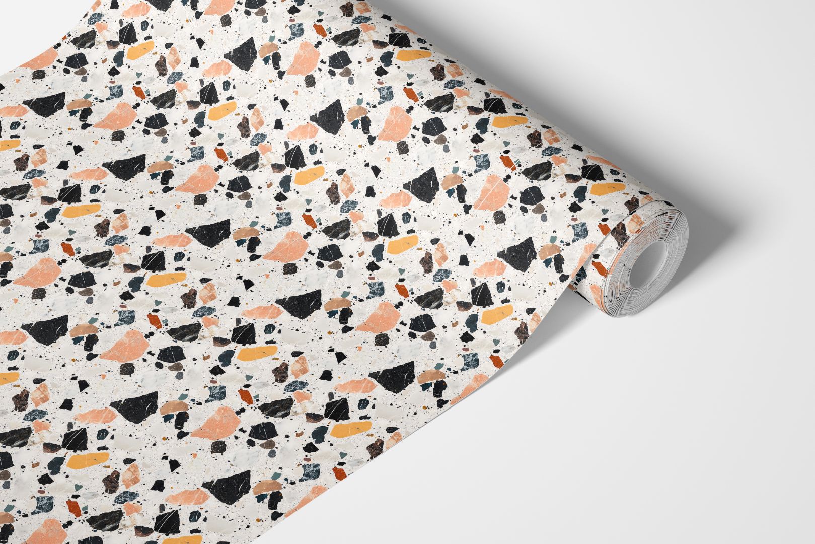 Marlo Terra Stone Countertop Film roll featuring a modern terrazzo-inspired pattern in ivory, caramel, and charcoal tones.