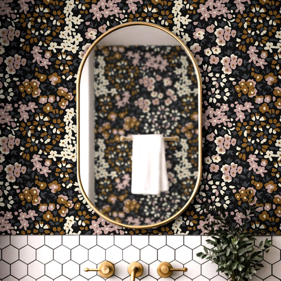 Dark floral calico wallpaper featuring mauve and warm neutral blooms shown in a bedroom or powder room setting.