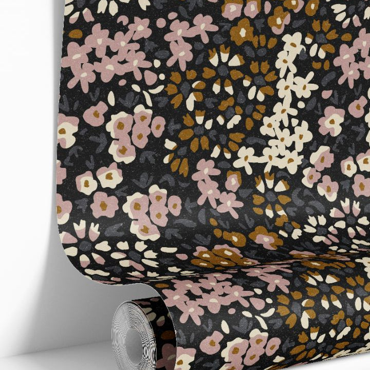 Close-up view of mauve petal calico wallpaper pattern with soft floral shapes and rich background tones