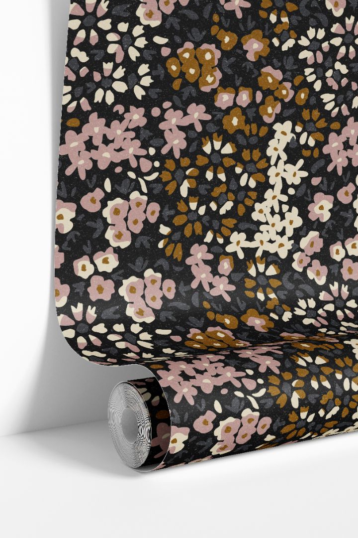 Close-up view of mauve petal calico wallpaper pattern with soft floral shapes and rich background tones