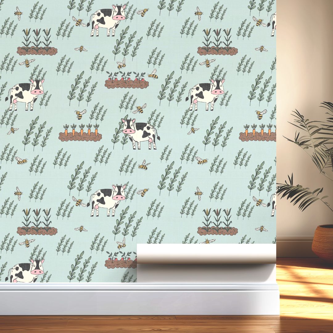 Moo Meadow Farm Wallpaper displayed on wall, showing playful cow and bee farm pattern with carrot patches and leafy accents.