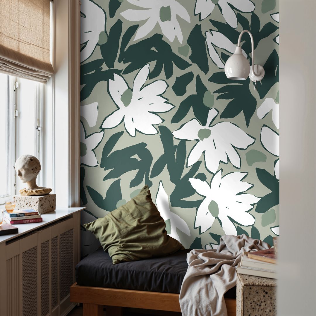 Mosselle Bloom Wallpaper in cozy reading nook with sculpture and pillows, highlighting layered green depth