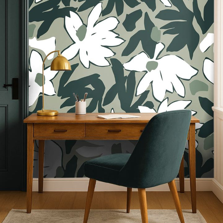 Mosselle Bloom Wallpaper styled behind wooden desk and brass lamp, showing organic olive and ivory tones