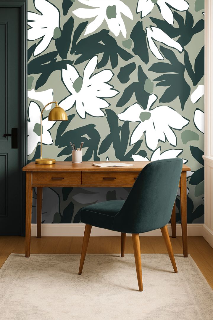 Mosselle Bloom Wallpaper styled behind wooden desk and brass lamp, showing organic olive and ivory tones