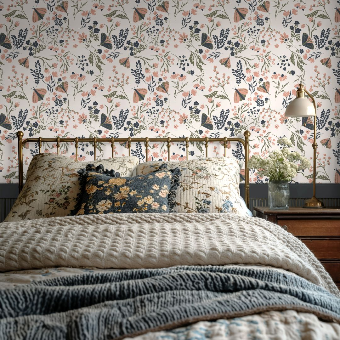  Bedroom styled with Mossmere Wilds wildflower botanical wallpaper featuring butterflies, sage stems, and dusty peach floral blooms.