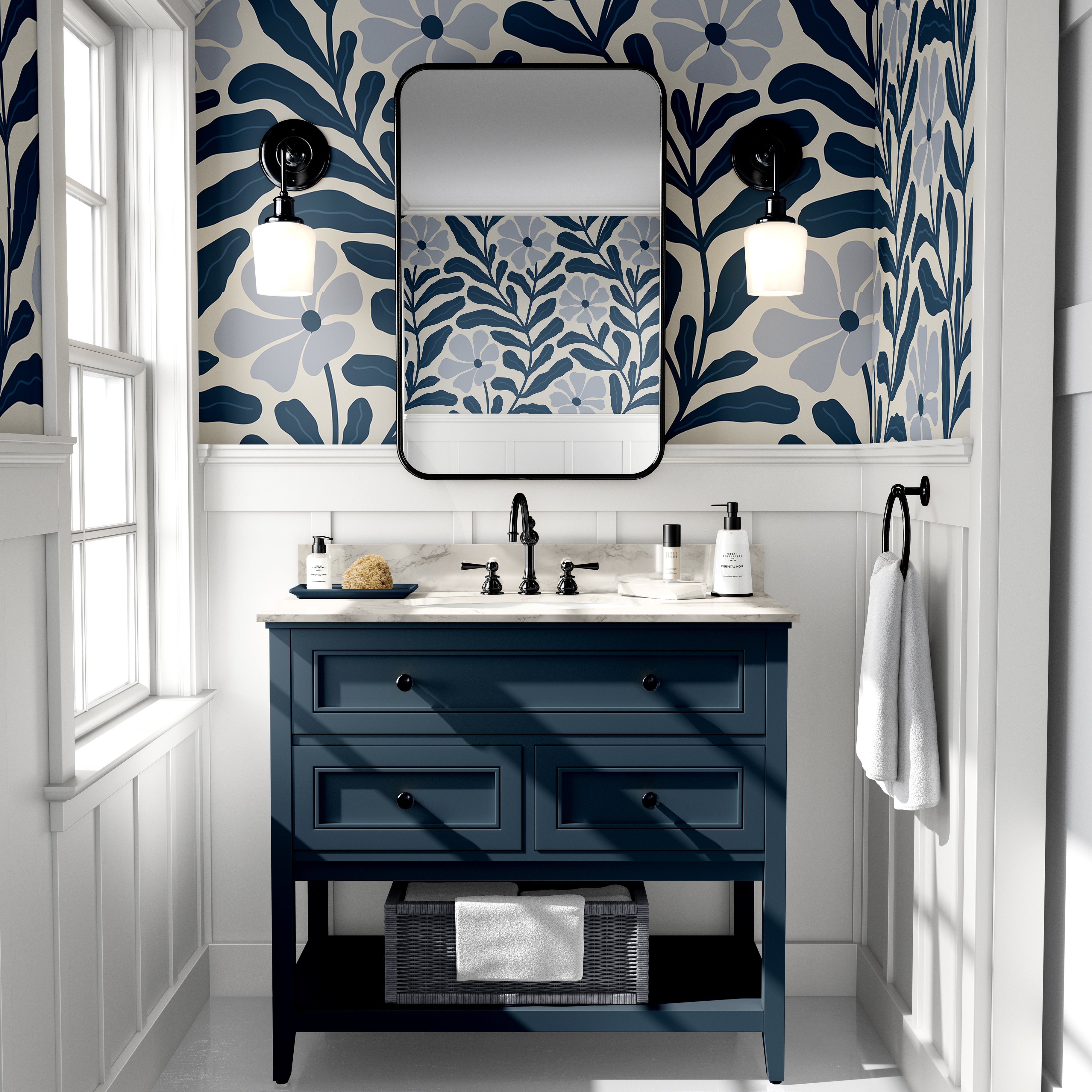 Navy Nature floral wallpaper with oversized navy botanical leaves and soft blue flowers styled above a navy bathroom vanity.