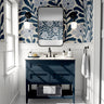 Navy Nature floral wallpaper with oversized navy botanical leaves and soft blue flowers styled above a navy bathroom vanity.