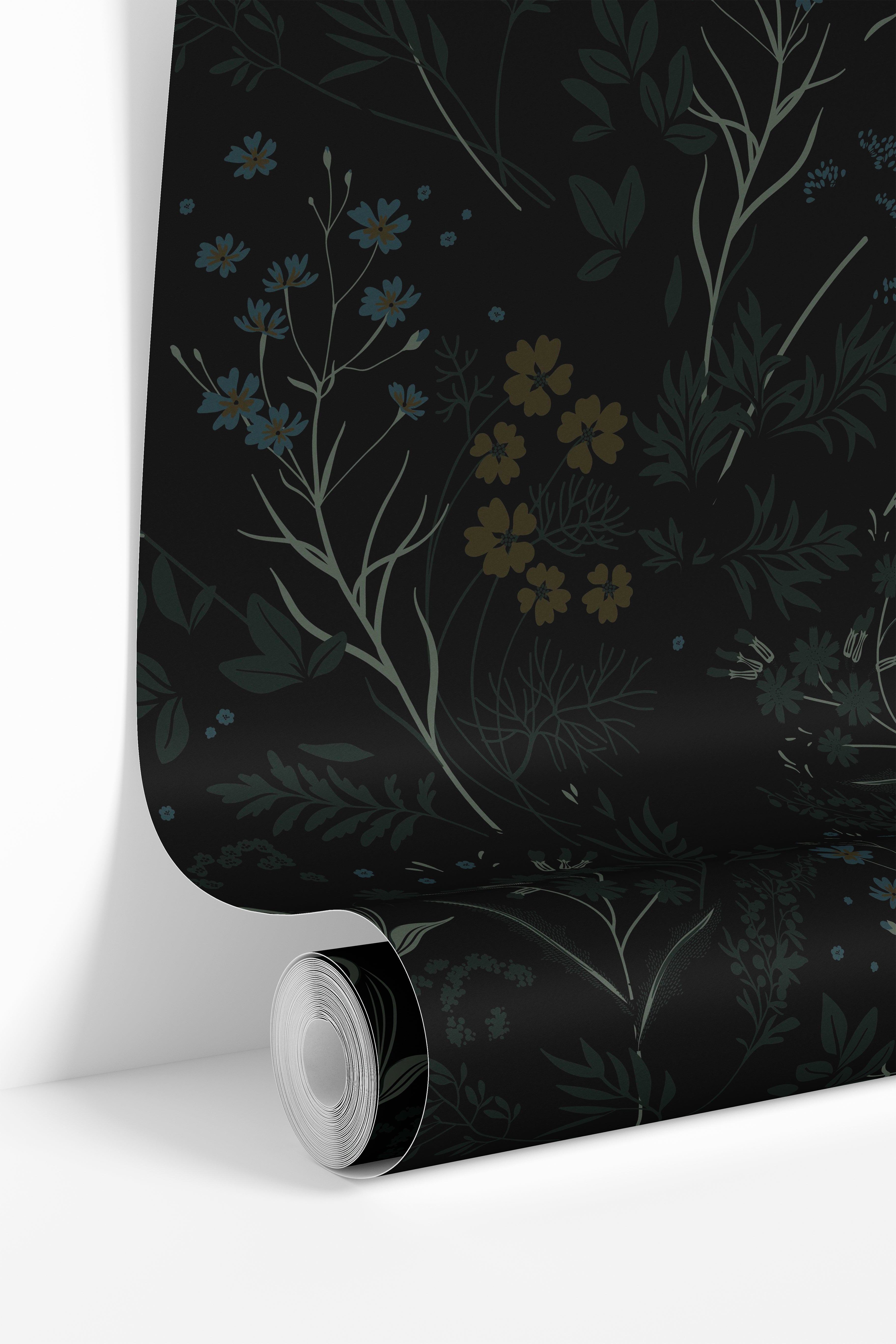 Close-up of Obsidian Wildflower wallpaper showing dark floral botanical detailing with muted blue flowers and earthy foliage on a black background.