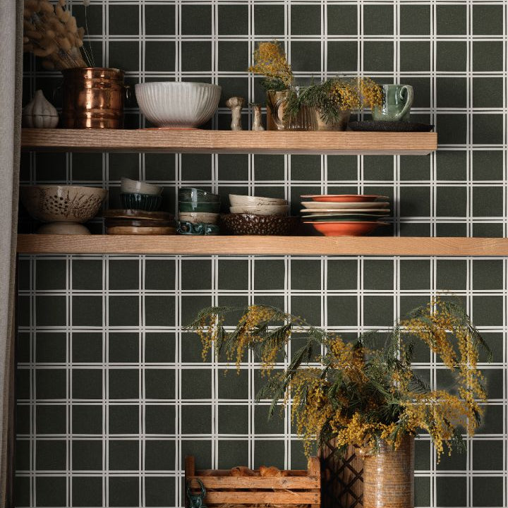 Elmstead Grid olive green wallpaper with structured square grid pattern styled in a modern kitchen interior