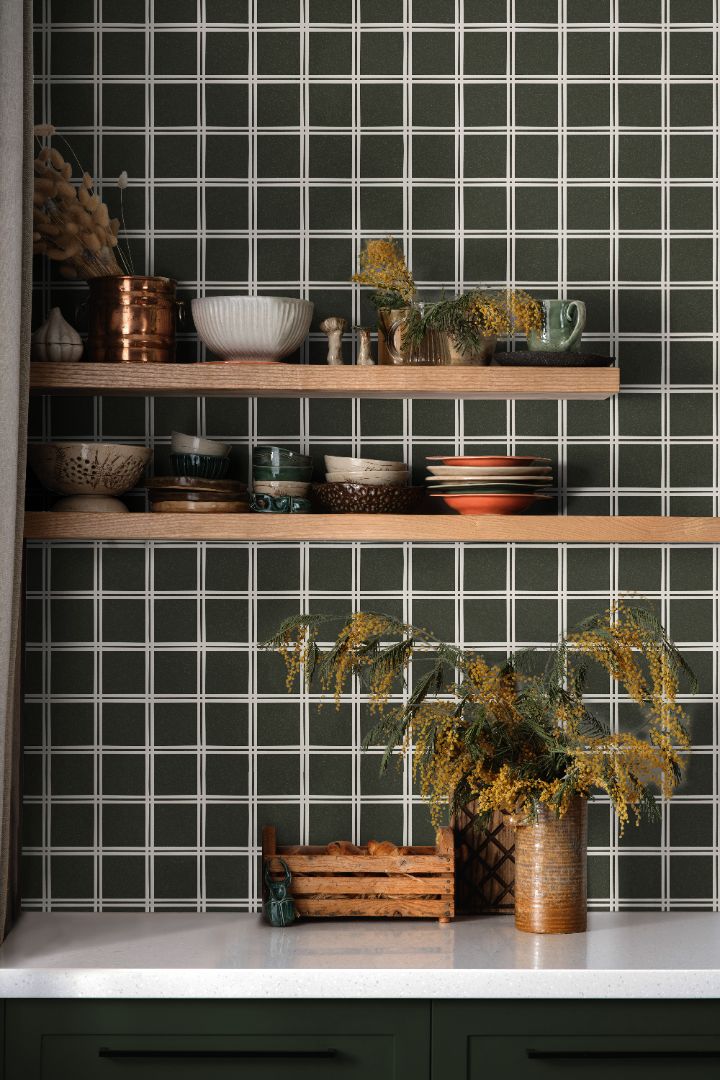 Elmstead Grid olive green wallpaper with structured square grid pattern styled in a modern kitchen interior