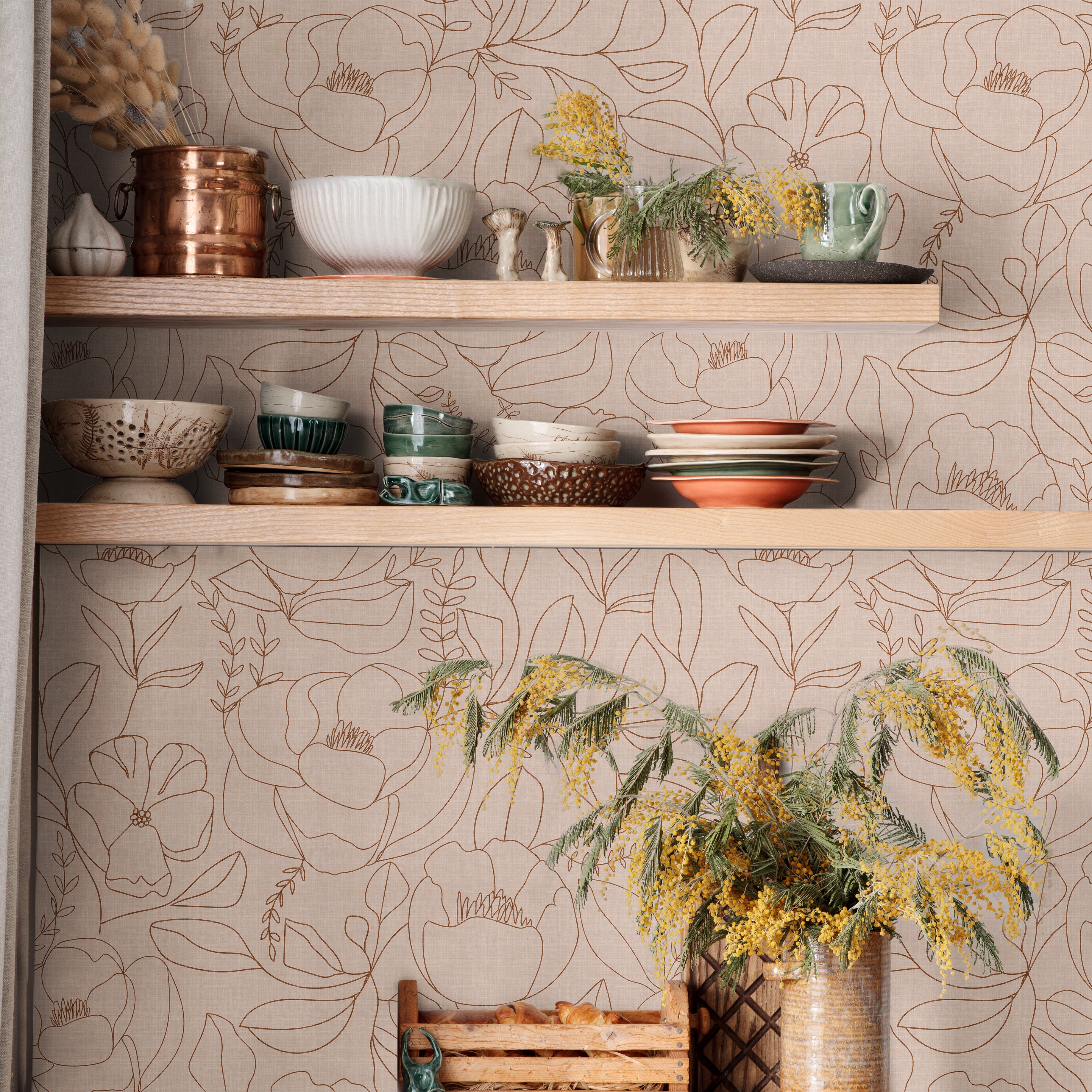 Open Bloom blush floral wallpaper with botanical line art in a warm kitchen with open wood shelving and green cabinets