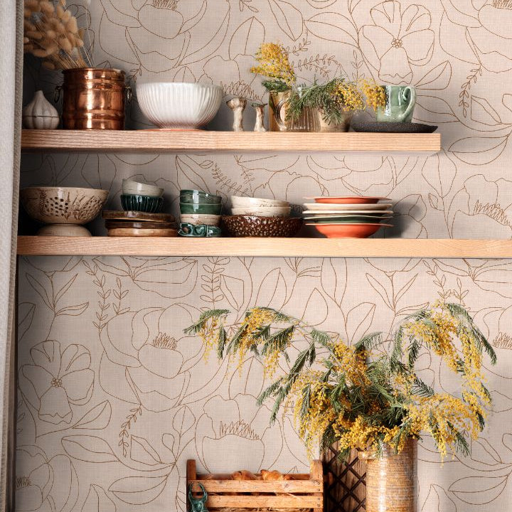 Line-drawn floral wallpaper in warm beige and clay tones styled in a kitchen shelving space