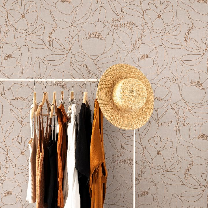 Neutral botanical wallpaper with clay linework on a beige background in a modern interior