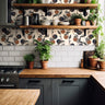 orchard fruit wallpaper behind wooden kitchen shelves with plants