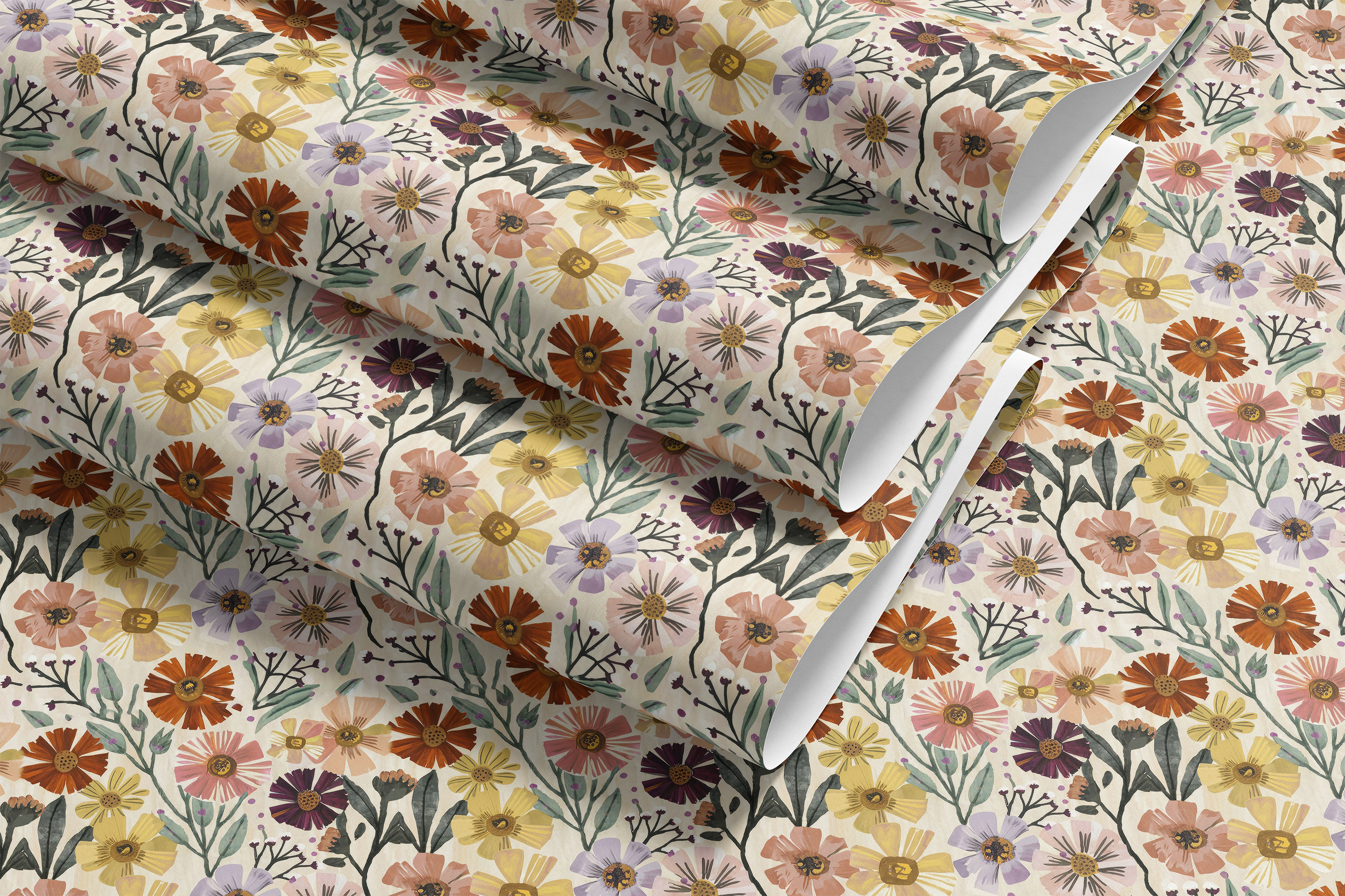  roll of painted bloomscape contact paper with multicolor flowers sage leaves and cream background on installed painted bloomscape on desk
