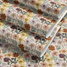  roll of painted bloomscape contact paper with multicolor flowers sage leaves and cream background on installed painted bloomscape on desk